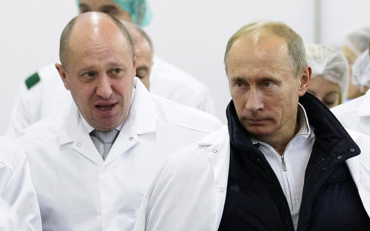 Yevgeny Prigozhin, left, and Russian President Vladimir Putin in 2010