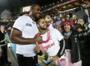 Rugby Union - Uruguay v Fiji - IRB Rugby World Cup 2015 Pool A - Stadium MK, Milton Keynes, England - 6/10/15 Fiji's Api Ratuniyarawa celebrates with fans at the end of the match Action Images via Reuters / Andrew Boyers Livepic