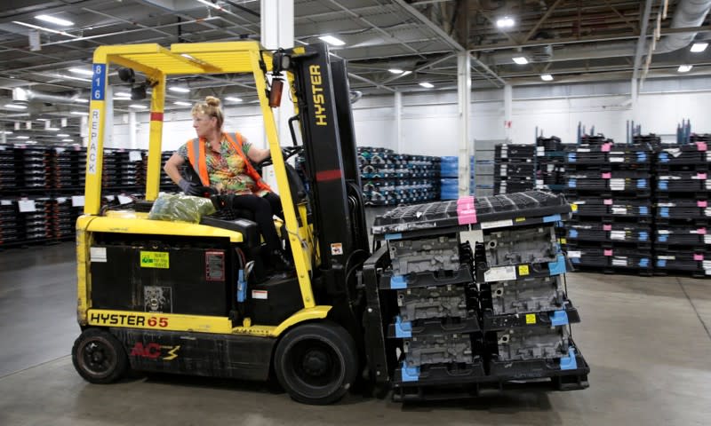 A hi-lo driver unloads engine block castings, used in a variety of General Motors cars, trucks and crossovers, coming into the GM Romulus Powertrain plant in Romulus,