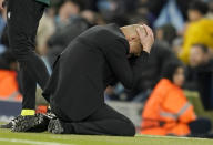 Manchester City's head coach Pep Guardiola reacts during the Champions League quarterfinal second leg soccer match between Manchester City and Real Madrid at the Etihad Stadium in Manchester, England, Wednesday, April 17, 2024. (AP Photo/Dave Thompson)