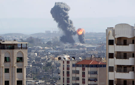 An explosion is seen during Israeli air strikes in Gaza October 27, 2018. REUTERS/Ahmed Zakot