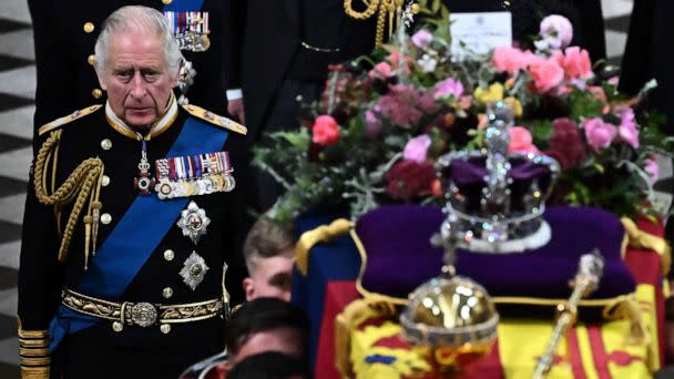 PHOTO: Britain's King Charles III walks beside The coffin of Queen Elizabeth II, draped in a Royal Standard and adorned with the Imperial State Crown and the Sovereign's orb and sceptre as it leaves Westminster Abbey in London, on Sept. 19, 2022.  (Ben Stansall/POOL/AFP via Getty Images)