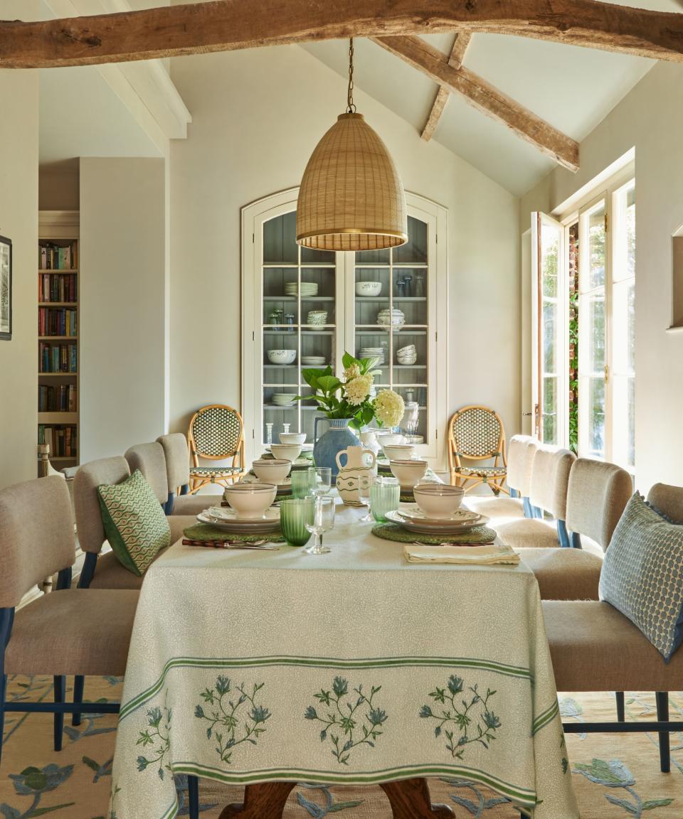 Dining table with cream tablecloth and leaf design