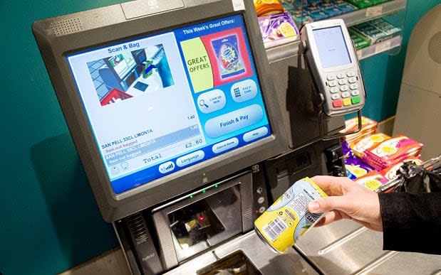 Cameras at self service checkouts are designed to deter shoppers from stealing low-value items by not scanning them - Copyright (c) 2014 Rex Features. No use without permission.