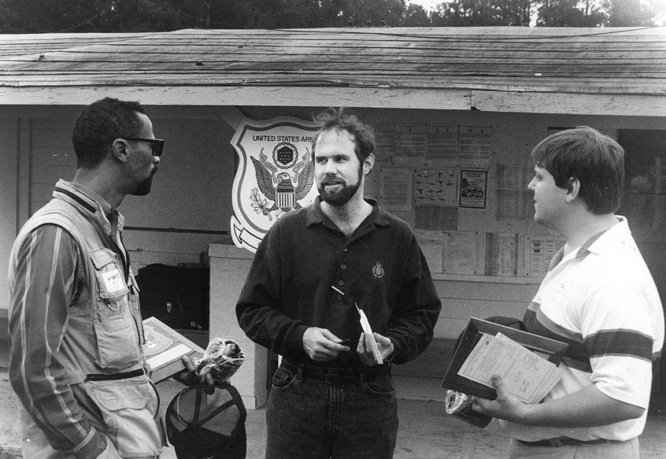 Tim Chitwood, center, speaks with WTVM cameraman Marion Lawhorn, left , WTVM sportscaster Dave Platta . Ledger-Enquirer file photo