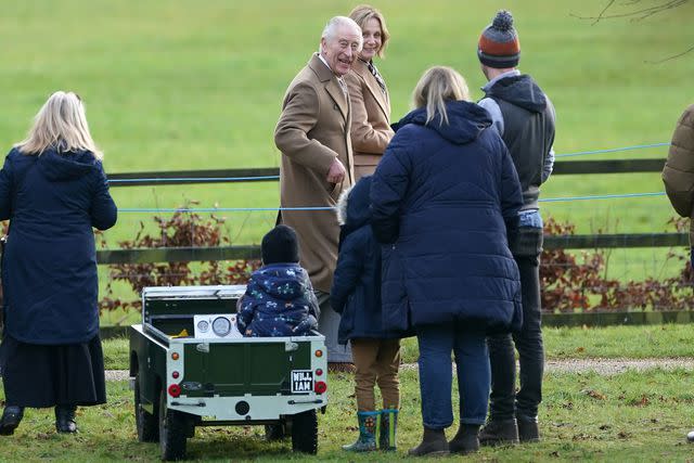 <p>Joe Giddens/PA Images via Getty</p> King Charles chats with the Ward family as he attends the Sunday service at St Mary Magdalene on Jan. 7.