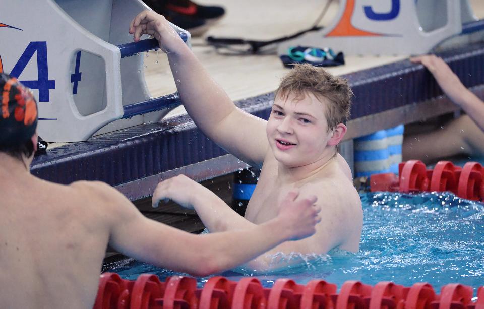 Cathedral Prep's Owen Carson smiles after winning the Class AA boys 500-yard freestyle during the District 10 swimming championships at S.P.I.R.E. Institute in Geneva, Ohio, on March 3.