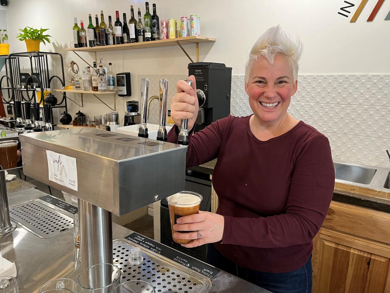 Co-owner Season Bowers pours a tea on tap with a nitro keg at the Intrepid Nitro Coffee and Tea Bar on Kingston Pike in Bearden. The nitro keg mixes nitrogen into a drink to make it frothy and adds taste.