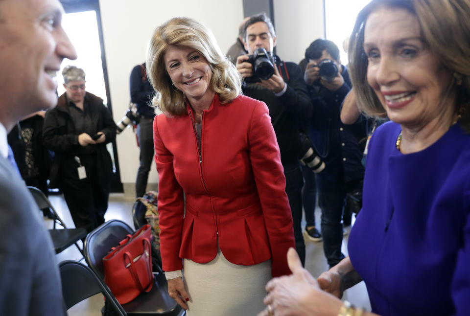 Former state senator Wendy Davis, center, visits with Speaker of the House Nancy Pelosi, D-Calif., right, following a stop for a news conference, Tuesday, March 5, 2019, in Austin, Texas. (AP Photo/Eric Gay)