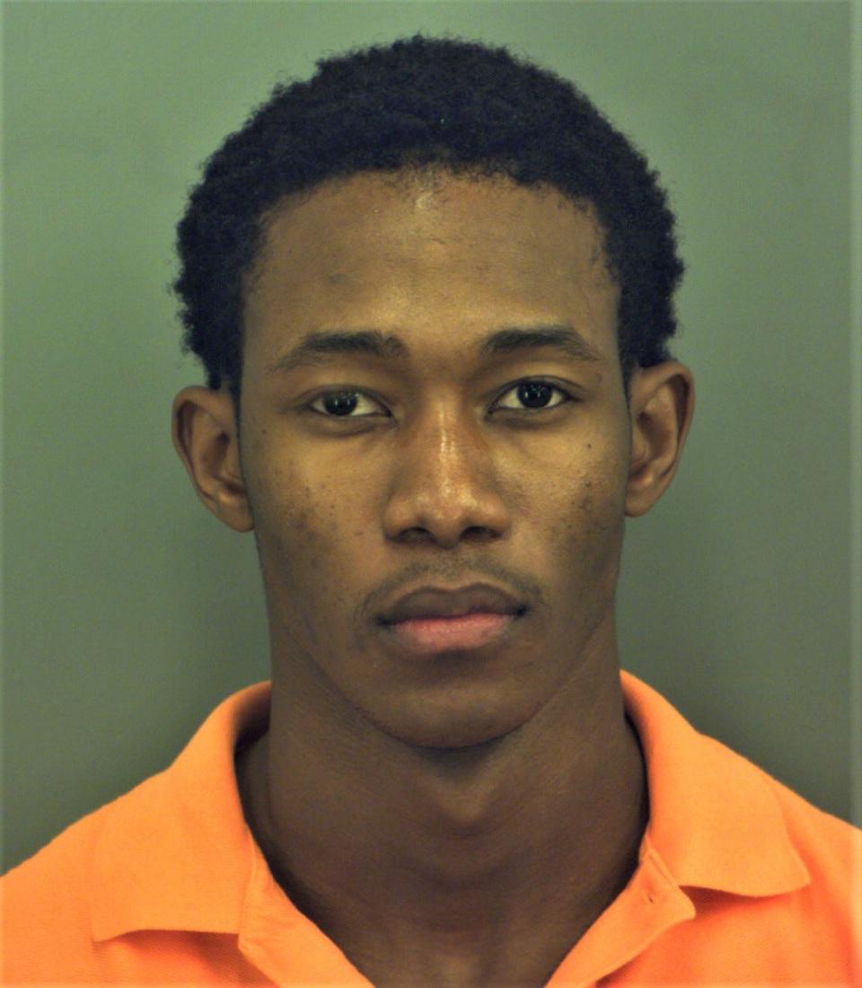 Richard Mustapha Sennessie and another suspect are accused of murder in an alleged vehicular assault ending in a fiery crash that killed Capt. Malcom Xavier Perry on Oct. 11 on John Hayes Street in the far East Side.