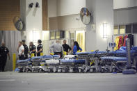 <p>Emergency personnel wait with stretchers at the emergency entrance to Orlando Regional Medical Center hospital for the arrival of patients from the scene of a fatal shooting at Pulse Orlando nightclub in Orlando, Fla., Sunday, June 12, 2016. (AP Photo/Phelan M. Ebenhack) </p>