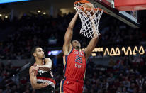 New Orleans Pelicans guard Trey Murphy III (25) shoots in front of Portland Trail Blazers forward Kris Murray (8) during the second half of an NBA basketball game in Portland, Ore., Tuesday, April 9, 2024. (AP Photo/Craig Mitchelldyer)