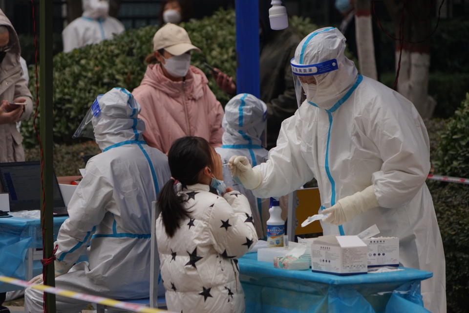 A young girl is tested for Covid in a closed community in Xi 'an, Shaanxi Province, China on January 4.