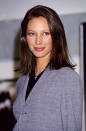 <p>Christy Turlington is the epitome of the 90s at this Calvin Klein advert launch, wearing plain grey and black</p>