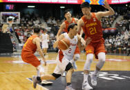 Japan's Yuki Togashi (2) plays during their FIBA Basketball World Cup 2023 Asian Qualifiers Group B match against China, Saturday, Nov. 27, 2021, in Sendai, northeastern Japan. The East Asia Super League is set to launch next October featuring some of the region’s biggest domestic clubs. It’s banking on Asia’s home-grown talent to grow from an invitational event to the world’s third-biggest basketball league. One is the so-called Golden Boy of the Philippines. Another is the first 100 million-yen-a-season basketball player in Japan Togashi. (AP Photo/Eugene Hoshiko)