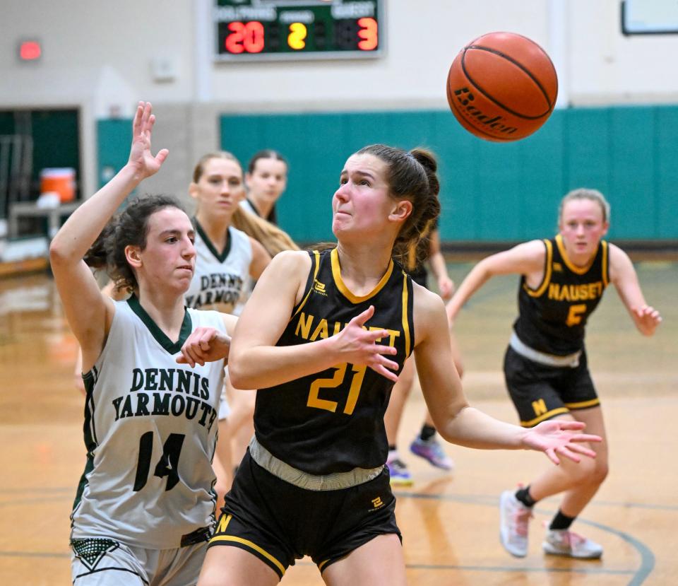 Pressured by Dennis-Yarmouth's Chloe Azoff, Gabby Foster of Nauset loses control of the ball during a Thursday game in South Yarmouth.