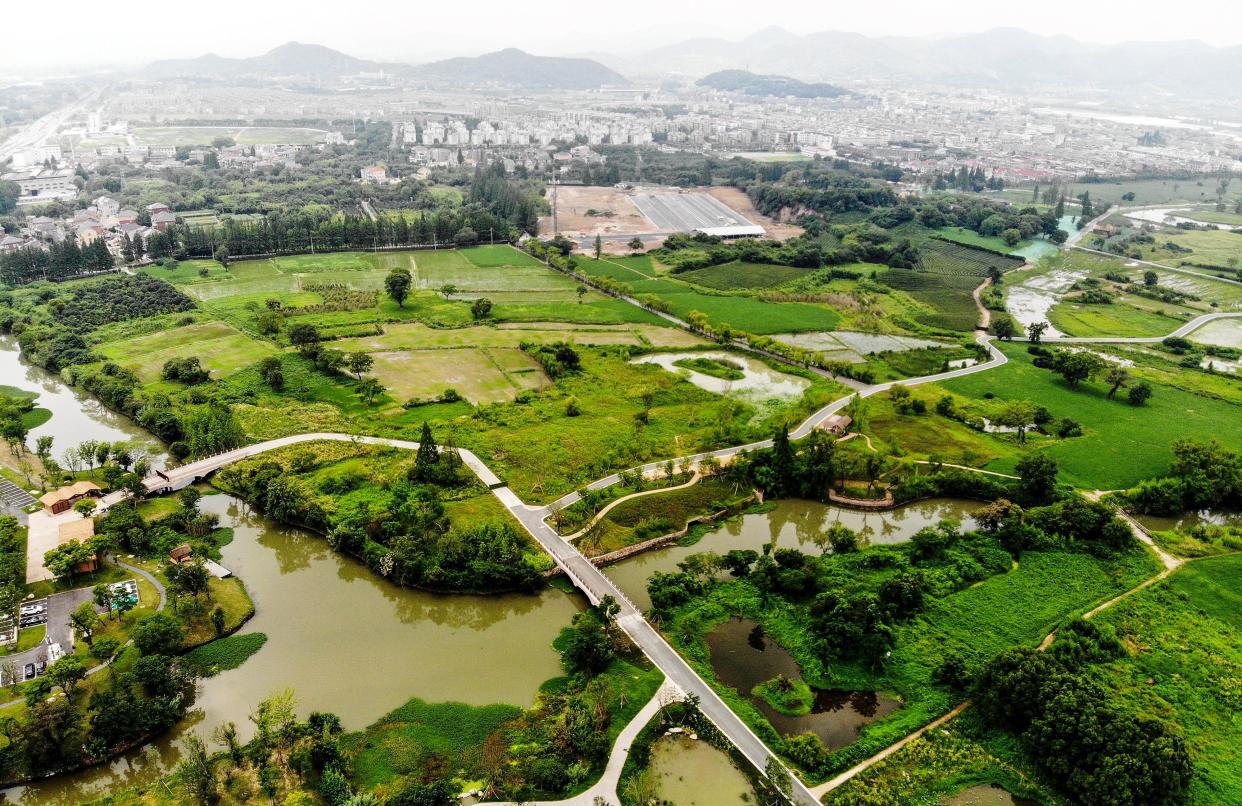 This aerial photo shows a general view of the Liangzhu City in Hangzhou in China's eastern Zhejiang province on July 6, 2019. - The UNESCO World Heritage Committee on July 6, 2019 inscribed China's Archaeological Ruins of Liangzhu City on the World Heritage List as a cultural site, local media reported. (Photo by - / AFP) / China OUT        (Photo credit should read -/AFP via Getty Images)