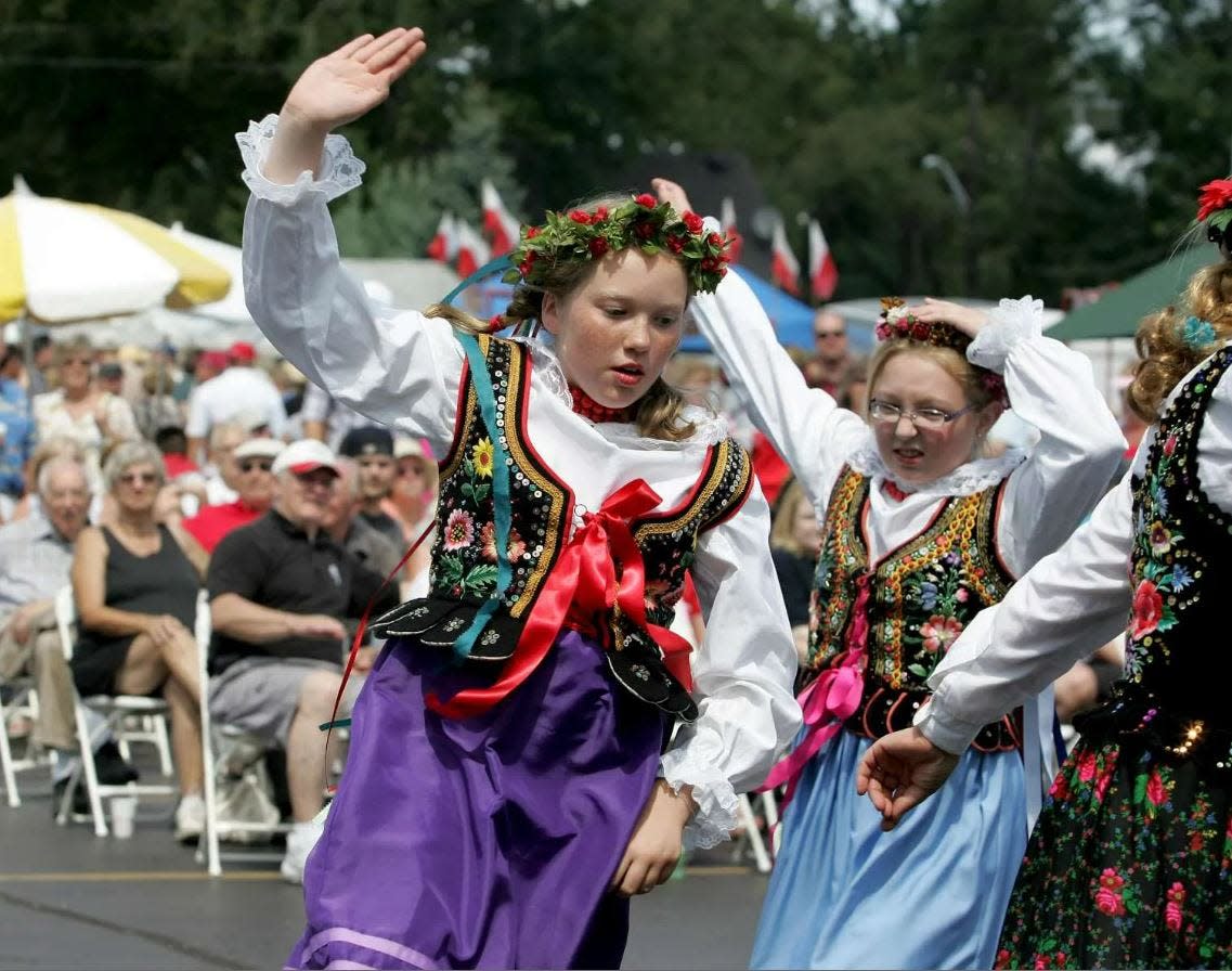 Monika Mazela (left) and Patrycja Tracz perform with the Krakowiaczek dance group Sunday, Aug. 21, 2011, during the Polish Fest at St. Stanislaus Kostka Church in Rockford.