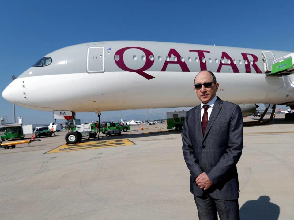 Qatar Airways Chief Executive Officer Akbar al-Baker poses in front of an Airbus A350-1000 (Reuters)