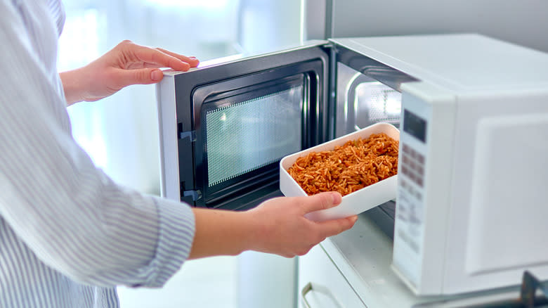 container of rice into microwave