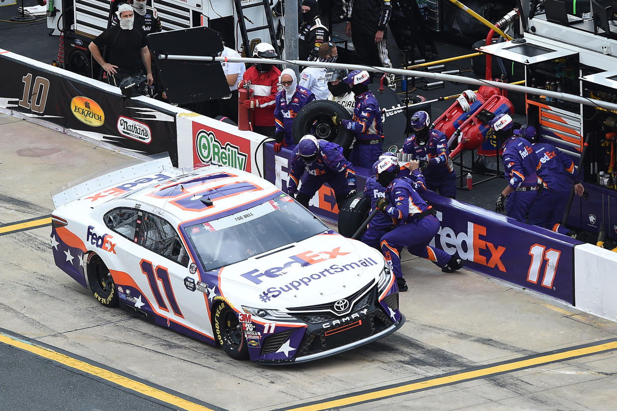 CONCORD, NORTH CAROLINA - MAY 24: Denny Hamlin, driver of the #11 FedEx SupportSmall Toyota,  pits during the NASCAR Cup Series Coca-Cola 600 at Charlotte Motor Speedway on May 24, 2020 in Concord, North Carolina. (Photo by Jared C. Tilton/Getty Images)