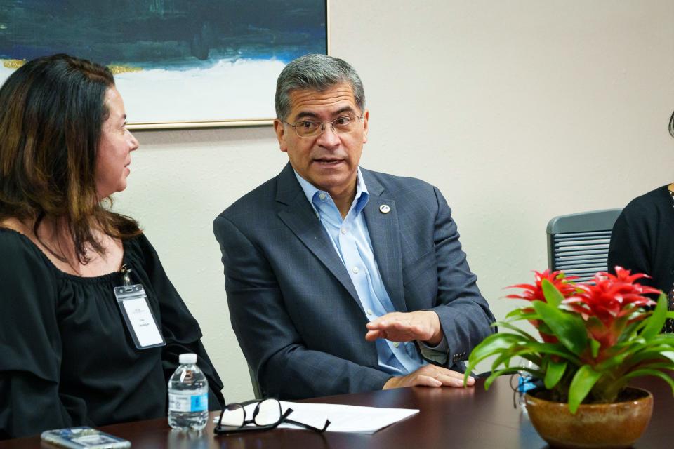 Health and Human Services Secretary Xavier Becerra speaks with South Mountain Post Acute leadership, including Lisa Leveque (left) on Dec 8, 2022, in Phoenix, Ariz. They discussed Arizona's low vaccination rates and the COVID-19 bivalent vaccine booster.