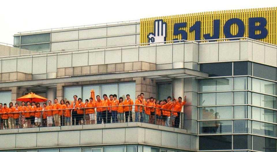 Employees on a balcony at 51job headquarters