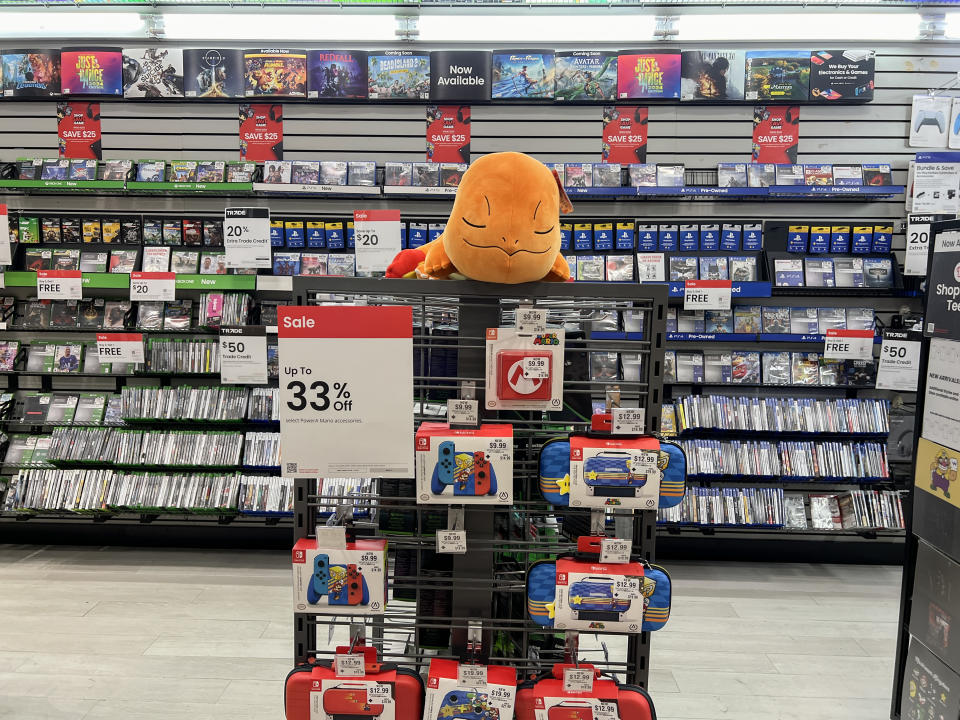 MIAMI, FLORIDA - MAY 28: Merchandise lines the shelves of a GameStop store on May 28, 2024 in Miami, Florida. GameStop stock jumped higher after the video game retailer announced that it had raised $933 million by selling 45 million common shares of its stock earlier this month. (Photo by Joe Raedle/Getty Images)