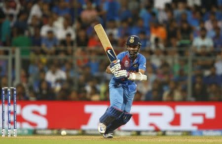 Cricket - West Indies v India - World Twenty20 cricket tournament semi-final - Mumbai, India - 31/03/2016. India's Ajinkya Rahane watches the ball after playing a shot. REUTERS/Danish Siddiqui