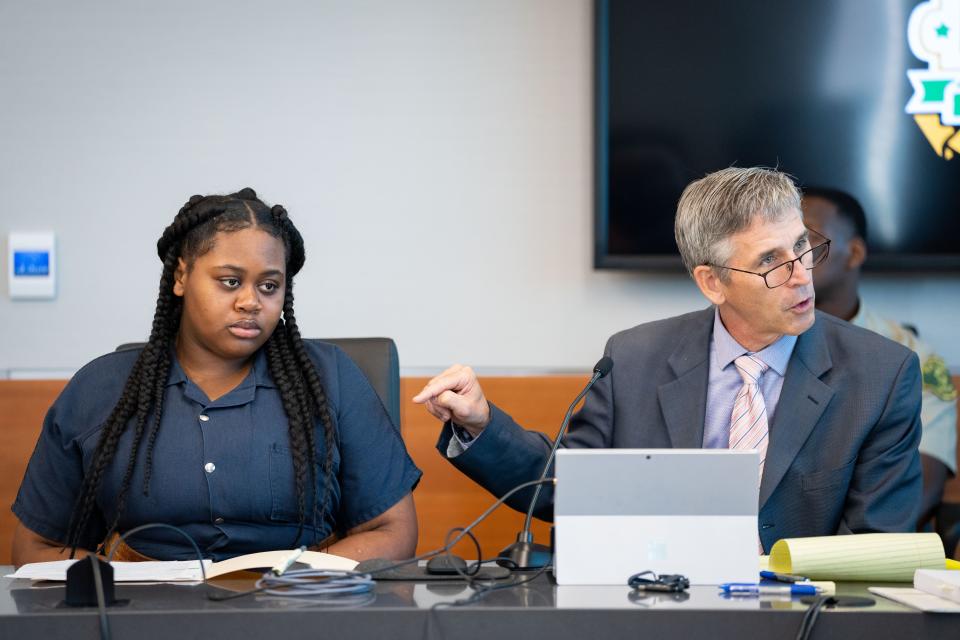 Pieper Lewis listens as her attorney Matthew Sheeley questions a witness during a sentencing hearing Tuesday. The Des Moines teen pleaded guilty to killing her alleged rapist in June 2020.