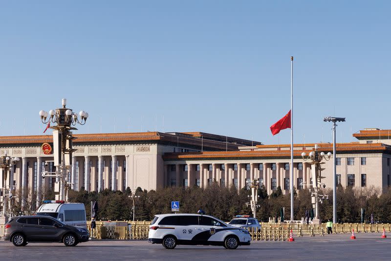 A Chinese flag flies at half-mast following the death of former Chinese President Jiang Zemin in front of the Great Hall of the People in Tiananmen Square in Beijing