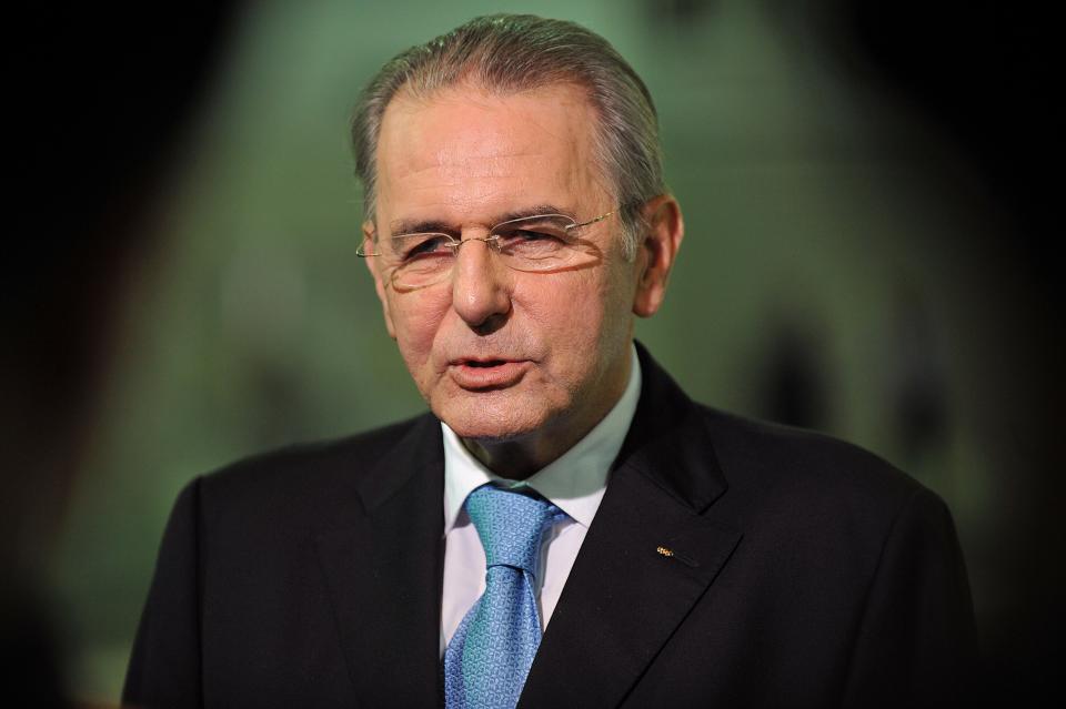 International Olympic Committee chief Jacques Rogge speaks during a television interview at the Aquatics Centre at the Olympic Park site, in east London, on July 27, 2011. The one-year countdown to the 2012 Olympics got under way on Wednesday with officials bullishly predicting London was on course to deliver the best ever games with 12 months to go. International Olympic Committee chief Jacques Rogge was set to extend a formal invitation to the world's athletes during a 7:00pm ceremony at Trafalgar Square in the culmination of day-long events to mark the one-year milestone.  AFP PHOTO / BEN STANSALL / WPA POOL (Photo credit should read BEN STANSALL/AFP/Getty Images)