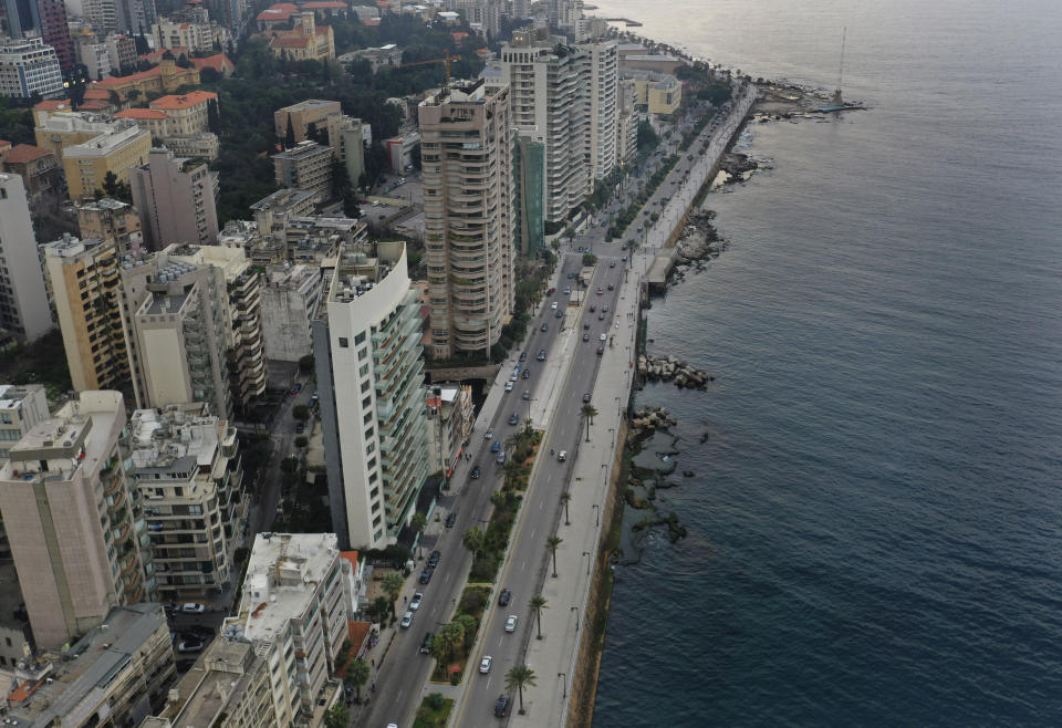 Beirut's waterfront promenade, along the Mediterranean Sea, is mostly empty after municipal policemen ordered people to leave, as the country's top security council and the government were meeting over the spread of the new coronavirus, in Beirut, Lebanon, in Beirut, Lebanon, Sunday, March 15, 2020. For most people, the virus causes only mild or moderate symptoms. For some it can cause more severe illness. (AP Photo/Hussein Malla)