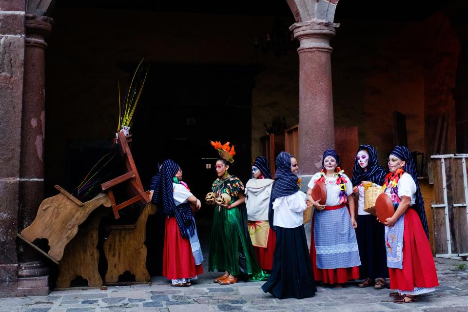 Dancers wait offstage during a traditional performance.