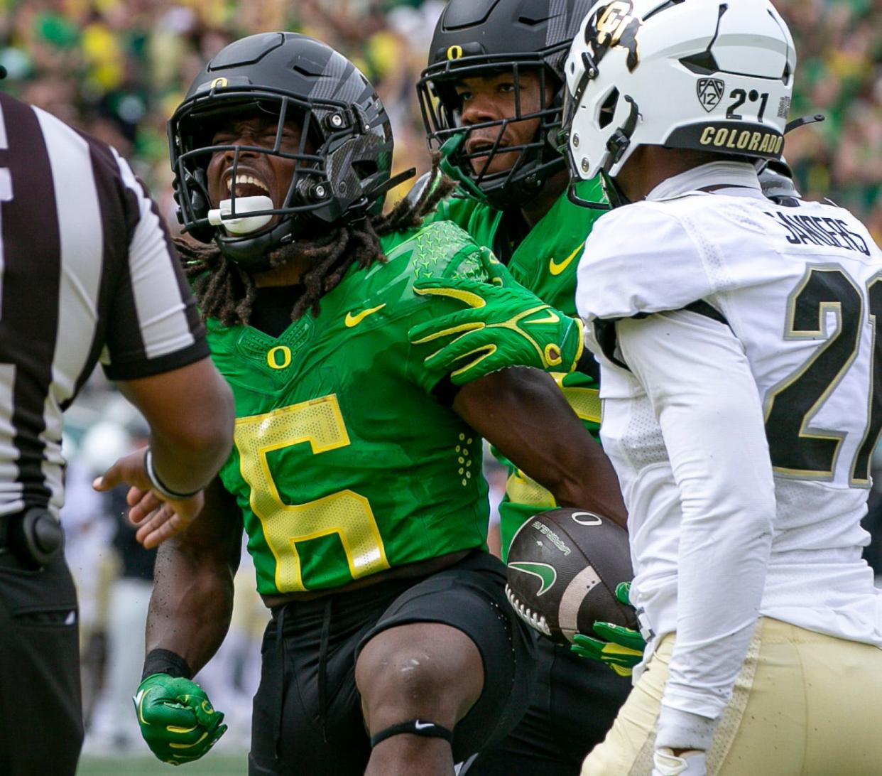 Oregon running back Noah Whittington celebrates a touchdown as the Oregon Ducks host Colorado in the Pac-12 opener Saturday, Sept. 23, 2023, at Autzen Stadium in Eugene, Ore.