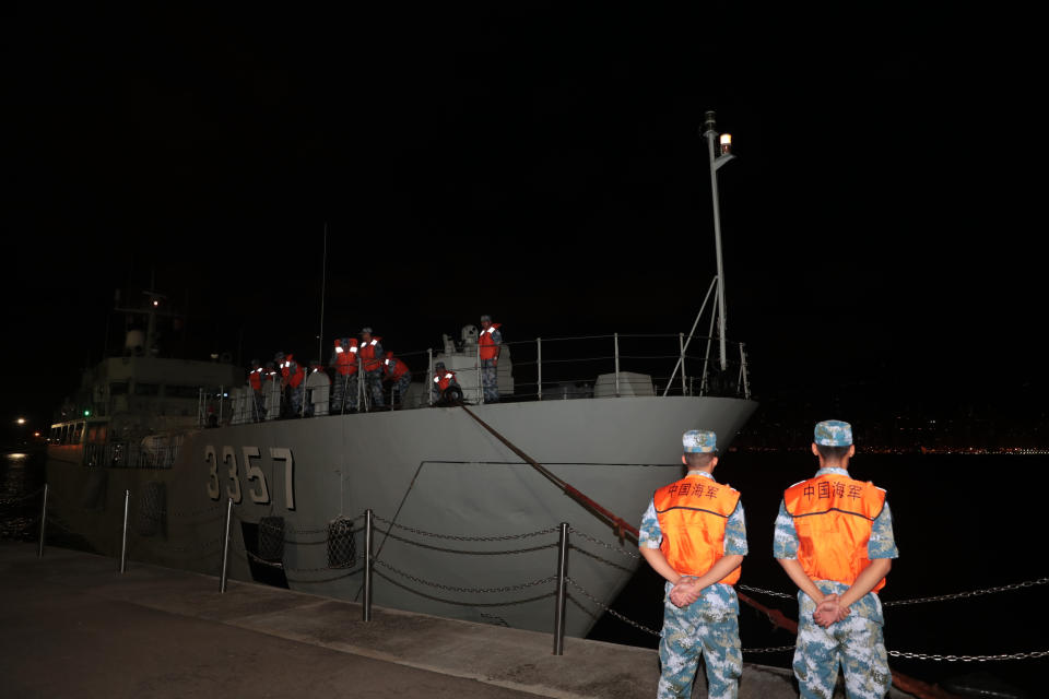 In this photo released by China's Xinhua News Agency, a ship from China's People's Liberation Army (PLA) Navy arrives at a naval base on Stonecutters Island in Hong Kong, Thursday, Aug. 29, 2019. Chinese state media has published photos of the country's Hong Kong-based troops' armored carriers and a patrol boat undertaking what they call a routine rotation. (Yuan Junmin/Xinhua via AP)