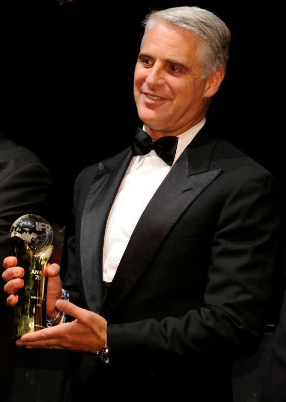 FILE PHOTO: Andrea Orcel poses with an award at the 2016 IFR Awards event in London