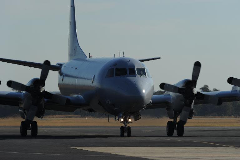 The first RAAF Orion aircraft arrives back at Pearce Airbase in Bullsbrook, 35 kms north of Perth, on March 27, 2014