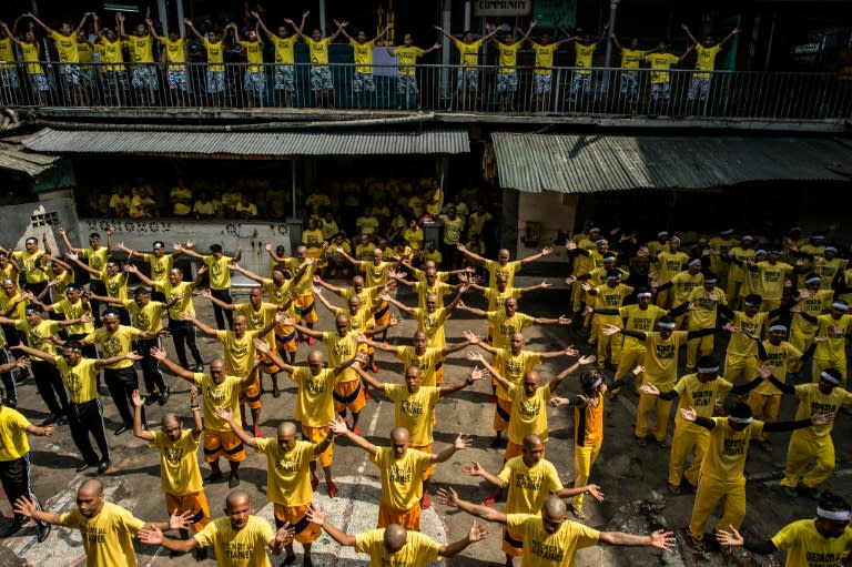 Inmates participate in a group dance contest inside the Quezon City Jail