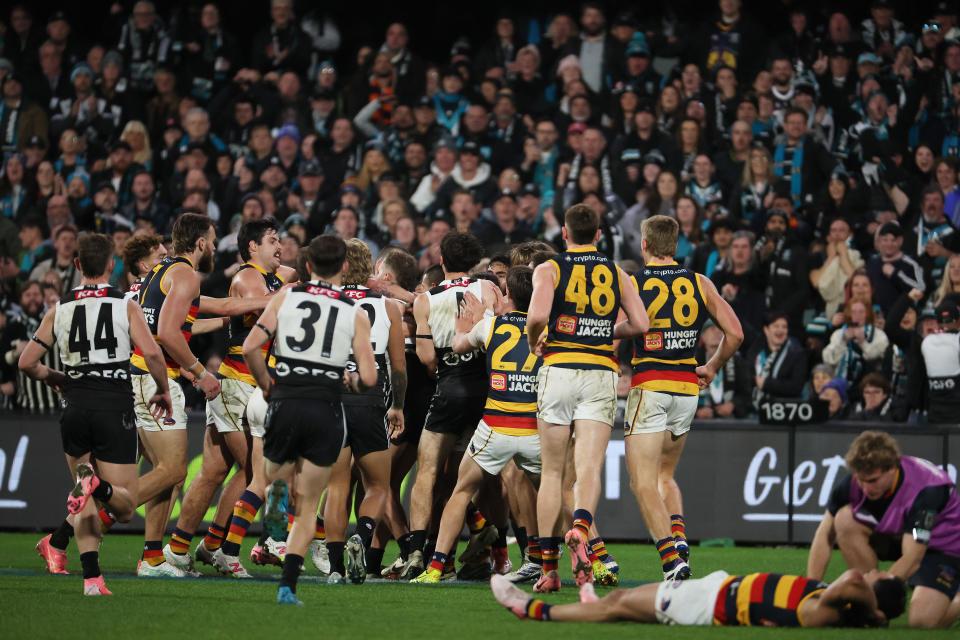 ADELAIDE, AUSTRALIA - AUG 17: The Power and Crows clash after Izak Rankine of the Crows is injured during the 2024 AFL Round 23 match between the port Adelaide Power and the Adelaide Crows at Adelaide Oval on August 17, 2024 in Adelaide, Australia. (Photo by James Elsby/AFL Photos via Getty Images)