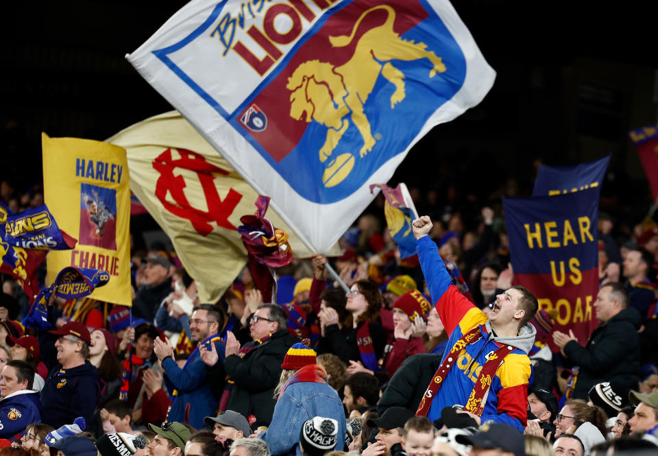 MELBOURNE, AUSTRALIA - AUGUST 17: Lions fans cheer during the 2024 AFL Round 23 match between the Collingwood Magpies and the Brisbane Lions at The Melbourne Cricket Ground on August 17, 2024 in Melbourne, Australia. (Photo by Michael Willson/AFL Photos via Getty Images)