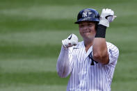 New York Yankees' Luke Voit reacts after hitting a double against the New York Mets during the first inning of the first baseball game of a doubleheader, Sunday, Aug. 30, 2020, in New York. (AP Photo/Adam Hunger)