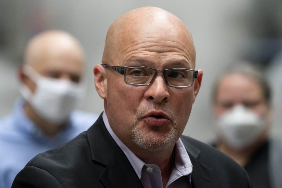 FILE - Michael Mulgrew, president of the United Federation of Teachers, a New York City teachers union, speaks during a news conference, Oct. 4, 2021, in the Manhattan borough of New York. He questioned whether the new testing initiatives will be available in every school by the time schools re-open Monday, Jan. 3, 2021. (AP Photo/John Minchillo, File)