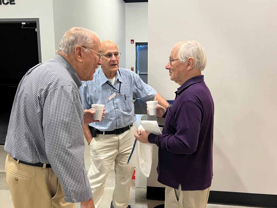 Members of the Wilmington Senior Men's Club greet each other before the start of the club's regular meeting at Life Point Church Pine Valley in Wilmington, N.C., on Friday, April 5, 2024.
