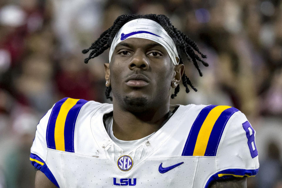 FILE - LSU wide receiver Malik Nabers jogs off the field after his touchdown during the first half of an NCAA college football game against Alabama, Saturday, Nov. 4, 2023, in Tuscaloosa, Ala. Nabers is a possible first round pick in the NFL Draft. (AP Photo/Vasha Hunt, File)