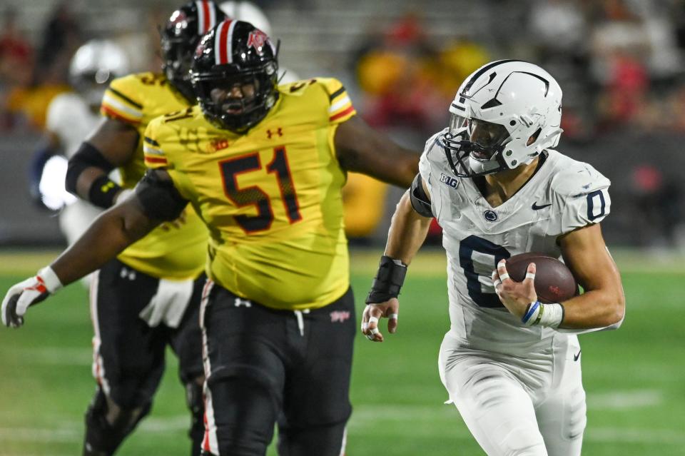 Nov 4, 2023; College Park, Maryland, USA; Penn State Nittany Lions linebacker Dominic DeLuca (0) returns a fourth quarter interception against the Maryland Terrapins at SECU Stadium. Mandatory Credit: Tommy Gilligan-USA TODAY Sports