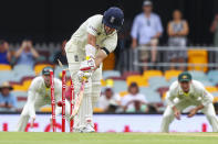 England's Rory Burns is out bowled during day one of the first Ashes cricket test at the Gabba in Brisbane, Australia, Wednesday, Dec. 8, 2021. (AP Photo/Tertius Pickard)
