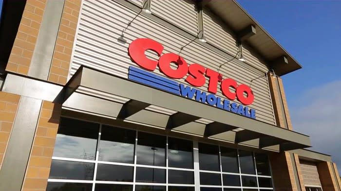 Exterior shot of a Costco Wholesale store with the logo on the sign.