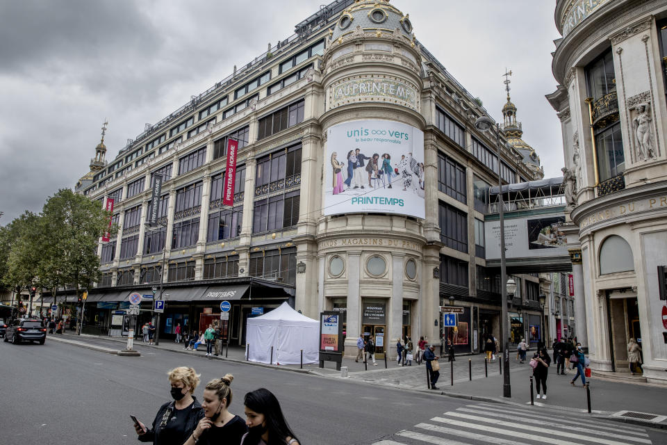 A COVID-19 testing tent is setup in front of Les Grands Magasins department store, in Paris, Thursday, Aug. 19, 2021. (AP Photo/Adrienne Surprenant)