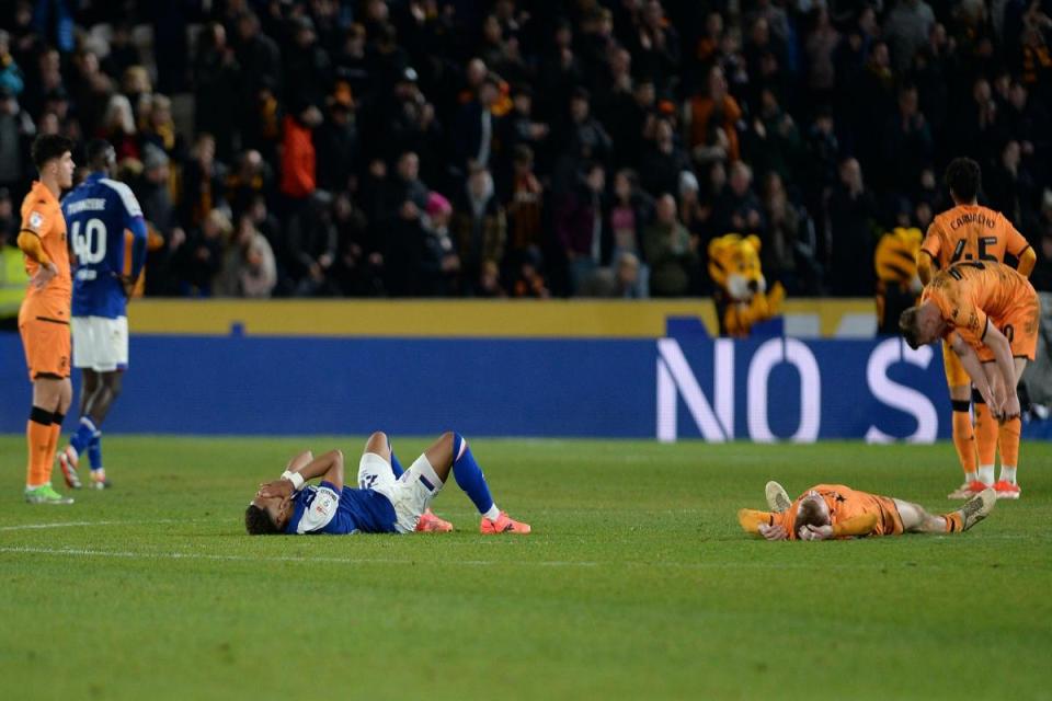 Omari Hutchinson and Matty Jacobs slump to the turf following the breathless 3-3 draw between Hull City and Ipswich Town. <i>(Image: Pagepix Ltd)</i>